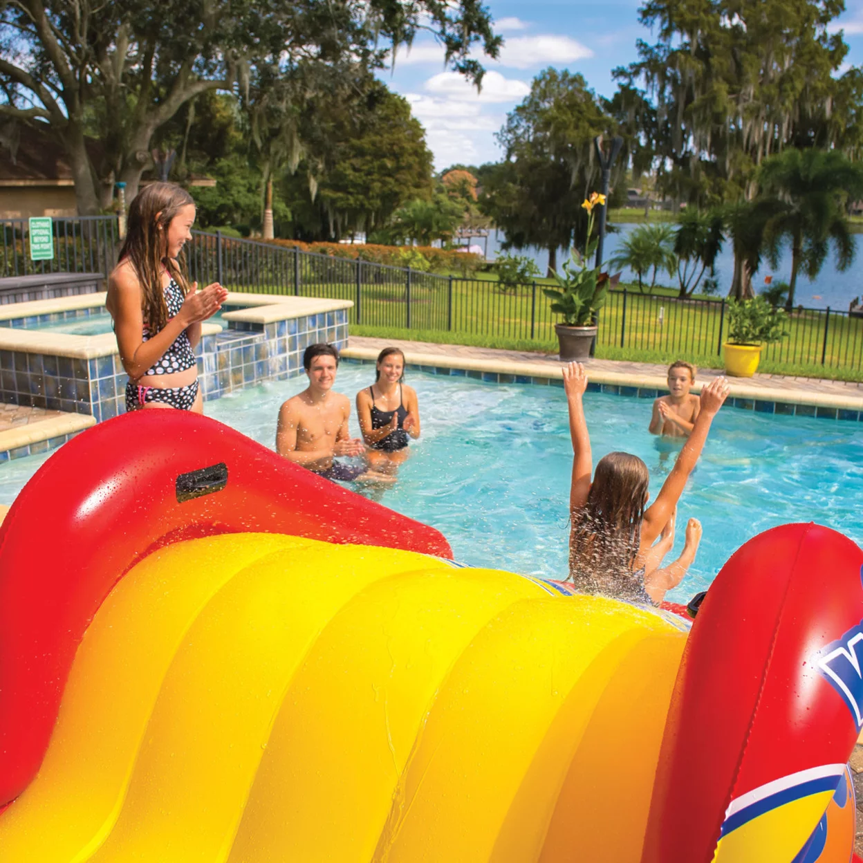 WOW Sports Slide N Smile Inflatable Pool Slide with Sprinklers for Kids and Adults - Womvr
